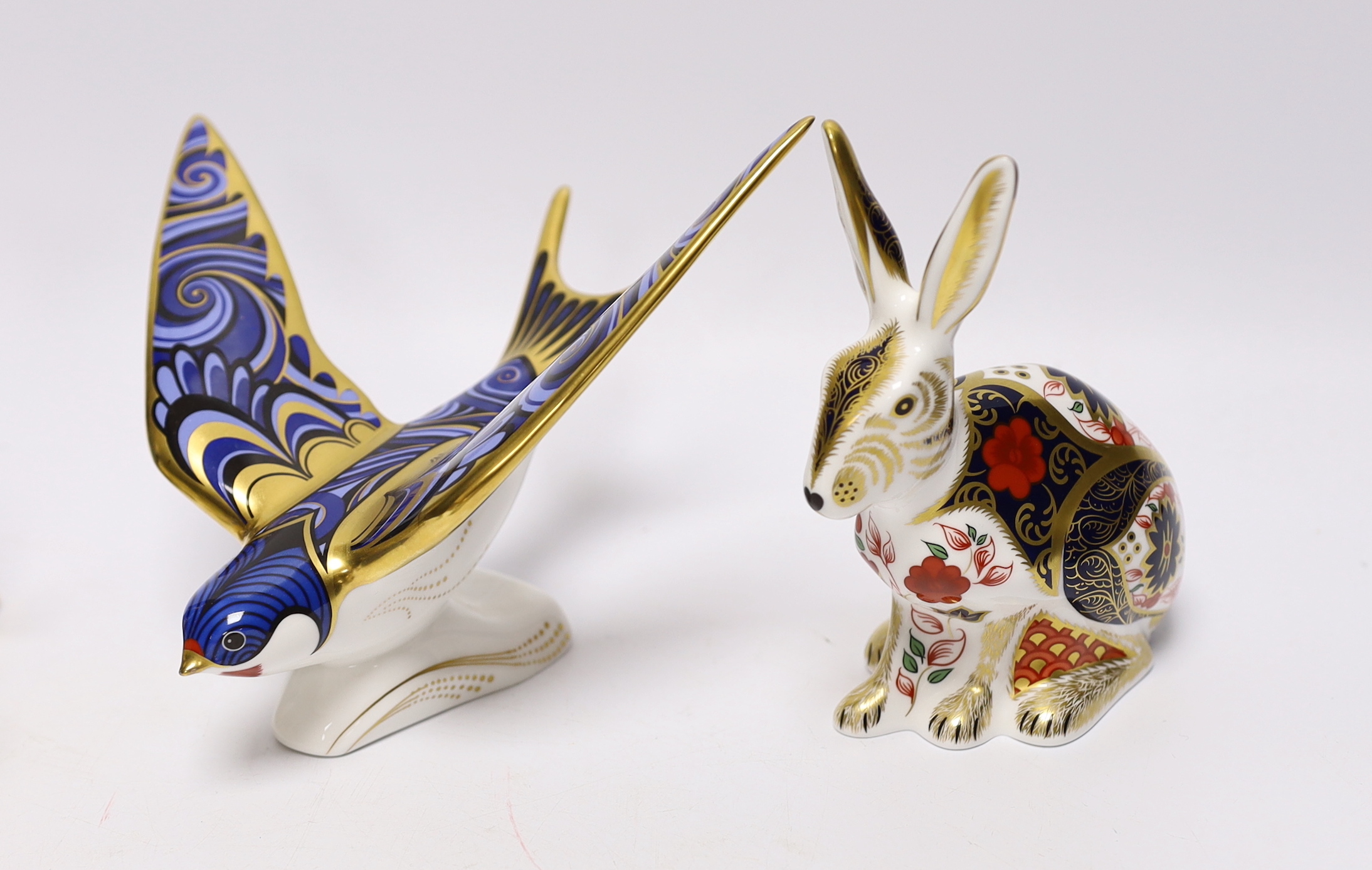 Eight Royal Crown Derby paperweight animal and bird models with boxes including Imari Hare and Emperor Penguin, largest 16cm wide